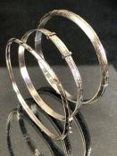 Three silver bangles