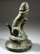 Bronze triple phallus with green patina, on circular stepped base, approx 6.5cm in height