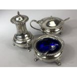 Silver Hallmarked Cruet set with blue glass liners comprising Salt, lidded mustard pot and pepper