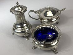 Silver Hallmarked Cruet set with blue glass liners comprising Salt, lidded mustard pot and pepper