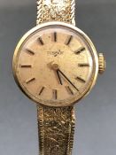 Wristwatch: A Tissot 9ct Gold Watch on 9ct Gold bracelet total weight approx 15g boxed with original