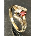 9ct Gold ring set with oval faceted stones size approx 'J'