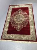 Red ground woven silk floral medallion pattern rug approx. 240cm x 160cm