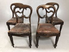 Set of four Victorian balloon backed dining chairs with leather seats