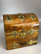 Victorian burr walnut dome-lid tea caddy with decorative brass embellishments, two compartments,