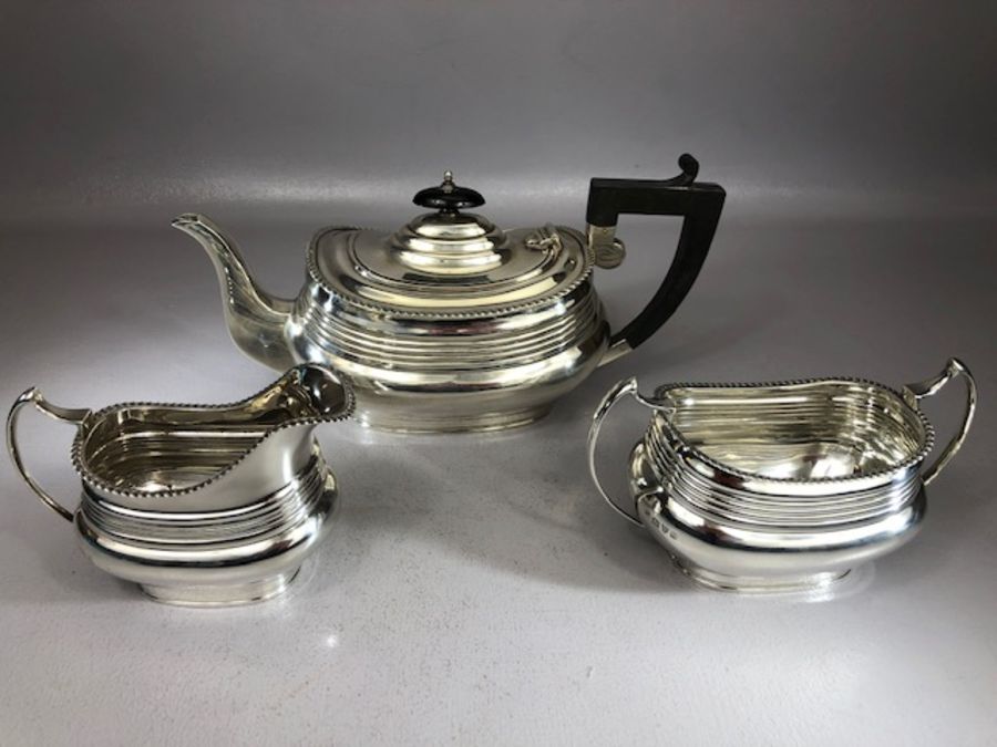Hallmarked Silver tea set comprising large teapot sugar bowl and milk Hallmarked for Chester total