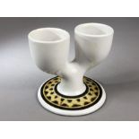Troika Pottery - a double egg cup in white with brown painted decoration to the circular foot,