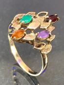 9ct Gold ring set with a variety of gem stones in a tiered design size 'U' total weight approx 2.