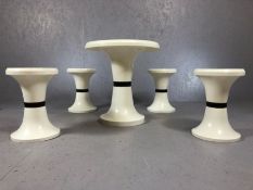 Mid Century / retro circular black and white table with four matching stools, in plastic, table