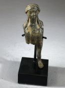 Fragmentary cast bronze applique in the shape of a sphinx, with finely incised details, brown