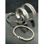 Collection of four modern silver bangles