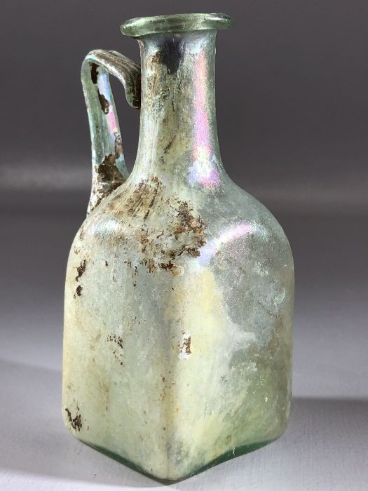 Square glass bottle, possibly Roman, in translucent blue/green glass, cylindrical neck very slightly - Image 2 of 11