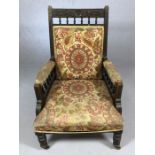 Upholstery project: Wooden framed armchair with carved detailing on four castors