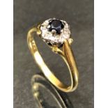18ct Gold and Platinum set Sapphire and Diamond Daisy styled ring approx size 'L'