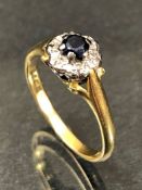 18ct Gold and Platinum set Sapphire and Diamond Daisy styled ring approx size 'L'