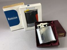 Two vintage Ronson lighters: a Varaflame Comet with original carton and booklet and a chrome