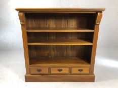 Modern solid wood bookshelf with three drawers under, approx 111cm x 37cm x 111cm tall