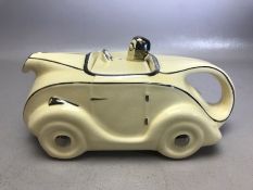 Sadler Art Deco OKT 42 racing car ceramic teapot in white and silver glazes, approx 23cm in length