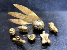 Collection of untested gold beads or amulets to include a bead with turquoise inserts, a shell