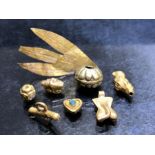 Collection of untested gold beads or amulets to include a bead with turquoise inserts, a shell