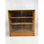 Mid Century bookcase with glass sliding doors and two shelves, approx 75cm x 30cm x 79cm