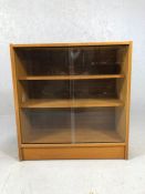 Mid Century bookcase with glass sliding doors and two shelves, approx 75cm x 30cm x 79cm