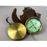 Brass compass in leather case, approx 7cm in diameter