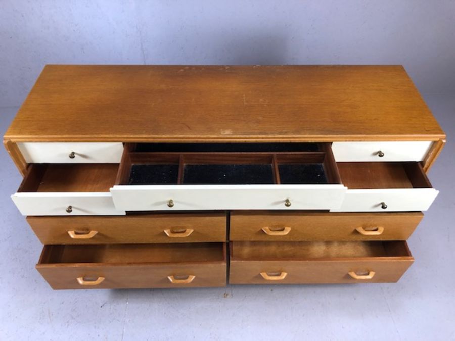 G-Plan Mid Century sideboard of ten drawers on black lacquered feet with brass detailing, six - Image 4 of 9