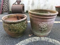 Two terracotta planters with applied design, the tallest approx 33cm