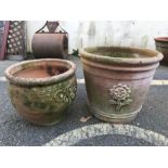 Two terracotta planters with applied design, the tallest approx 33cm