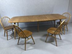 Ercol blond elm extending dining table table with pull-out action and drop-in hinged leaf, approx