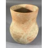 Small Roman terracotta cup or pot with slightly tapering neck and raised on a very slight foot,