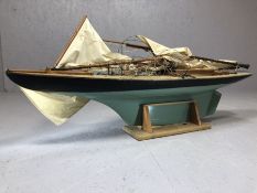 Wooden scale model of a yacht / sailing boat, approx 130cm in length, on cradled stand (A/F)