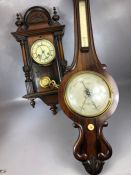 Vienna-style wooden cased wall clock with pendulum and key along with a mercury wooden cased wall