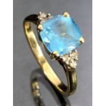 9ct Gold ring set with untested bright Blue Stone and diamond shoulders size 'Q'