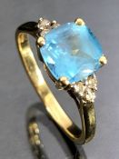 9ct Gold ring set with untested bright Blue Stone and diamond shoulders size 'Q'