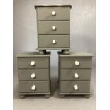 Three grey-painted pine bedsides, each with three drawers