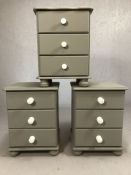 Three grey-painted pine bedsides, each with three drawers