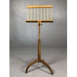 Adjustable wooden music stand on curved legs