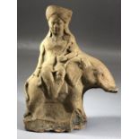 Small terracotta carved figure sitting to one side on an elephant, approx 13cm in height