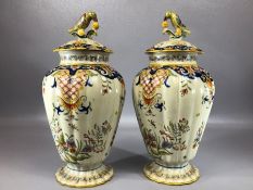 Pair of French Rouen pottery vases, each lid topped with a bird, approx 29cm in height, marked Rouen