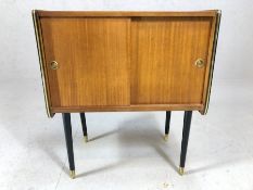 Mid Century G-Plan small cabinet on black lacquered legs with brass detailing, approx 61cm x 36cm
