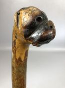 Carved wooden walking stick with head of a boxer or bulldog to handle