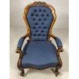 Victorian bedroom or nursing chair on carved oak frame in blue button back upholstery and on