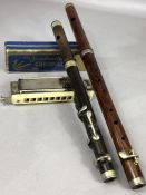 Small collection of musical instruments to include two wooden wind instruments, possibly piccolo,