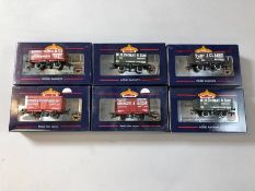 Collection of Bachmann OO/HO gauge rolling stock: seven wagons, 37-100E, 2x 37-100H, 37-178, 37-