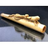 Carved Bone Cheroot or cigarette holder depicting a snake hunting a frog