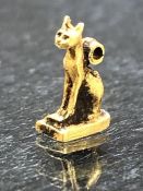 Miniature amulet, possibly Egyptian, in the form of a cat, possibly the Goddess 'Bastet', with