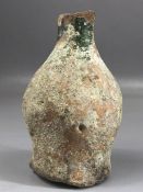 Small terracotta vase / bottle with remnants of green glaze to neck areas and white to body,
