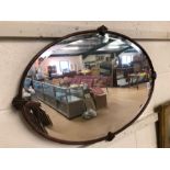 Oval wooden framed Art Deco bevel edged mirror with shell decoration approx 79cm x 53cm